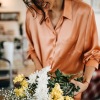 Lifestyle photo of woman with flowers